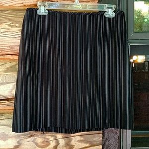Black skirt with light blue and cream stripes.9/10